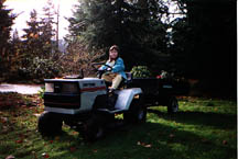 Fiona on tractor in front yard